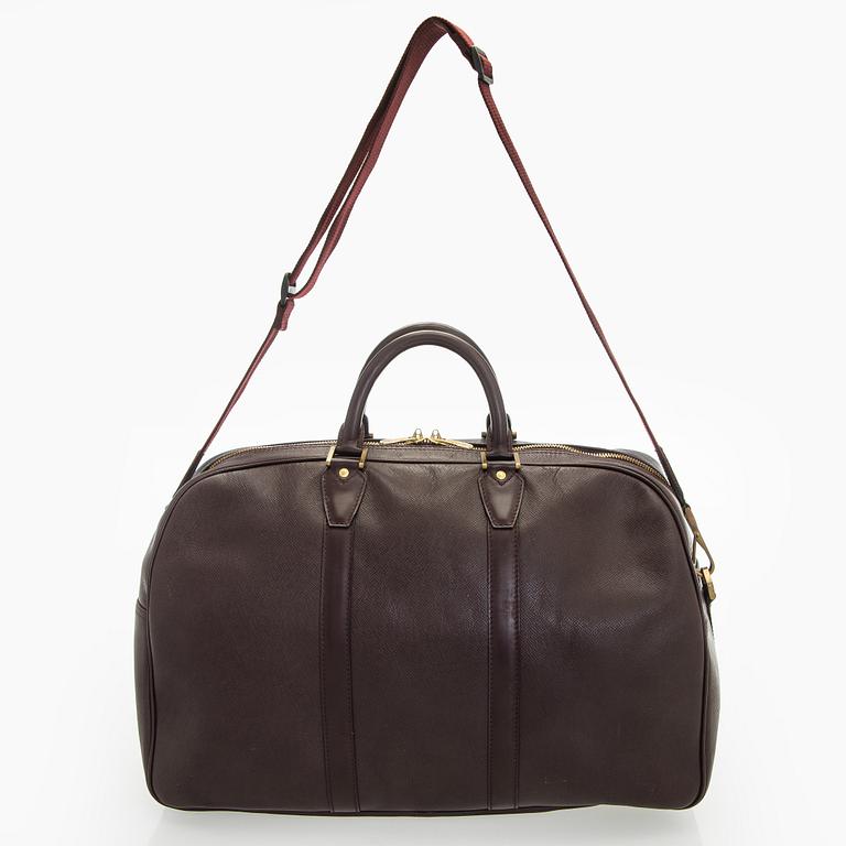 Louis Vuitton, a 'Taiga Kendall PM' weekend bag.
