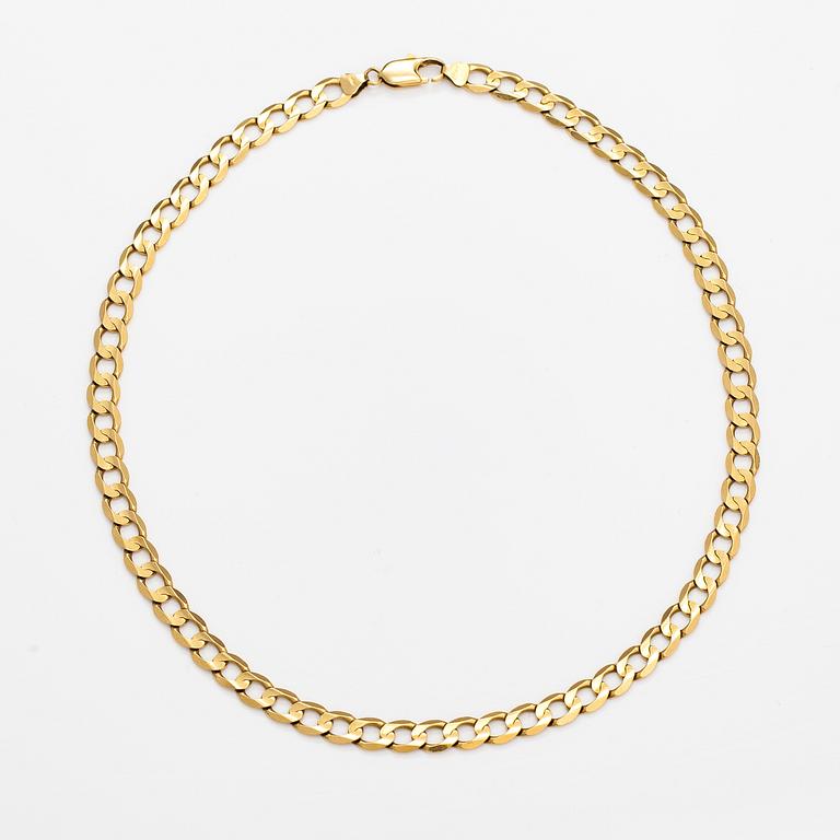 An 18K gold necklace. Unoaerre, Italy.
