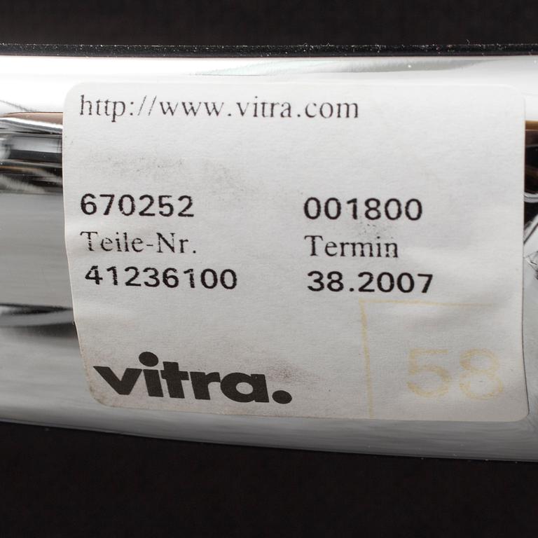 An 'EA 104 Swivel' armchair by Charles & Ray Eames, Vitra, 2007.