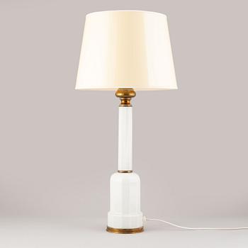 A glass and brass table lamp, mid/second half of the 20th century.