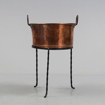 A 19th century copper cauldron.