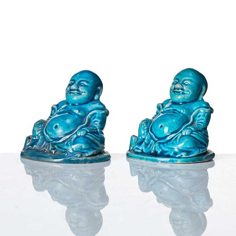 A pair of turquoise glazed joss stick holders in the shape of Buddai, Qing dynasty, 18th Century.