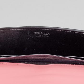 A Prada leather mini bag " Cahier" with metal details and rivets. Marked "Prada Milano". Authenticity card included.
