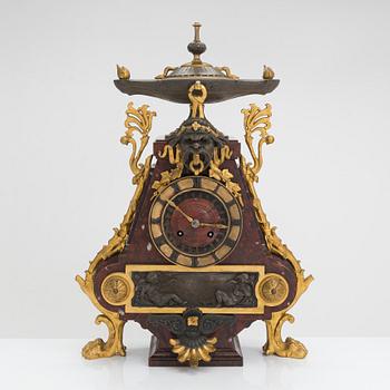 A French mantel clock and pair of candelabra from the last quarter of the 19th century.