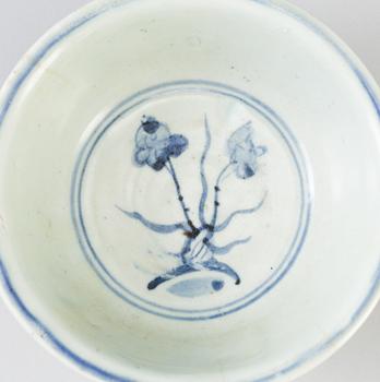 A blue and white Chinese porcelain bowl and two miniature jars for the South East Asian market, probably Ming dynasty.