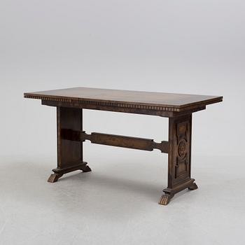 A 1920´s dinner table and six chairs probably designed by Axel Einar Hjorth for AB Svenska möbelfabriken Bodafors.