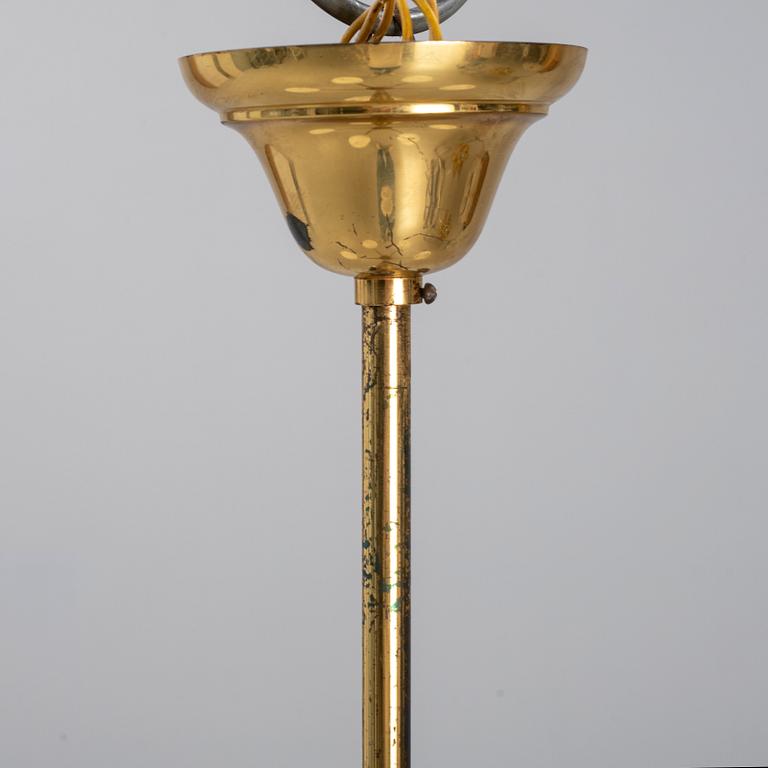 A 1950's glass and brass ceiling light.