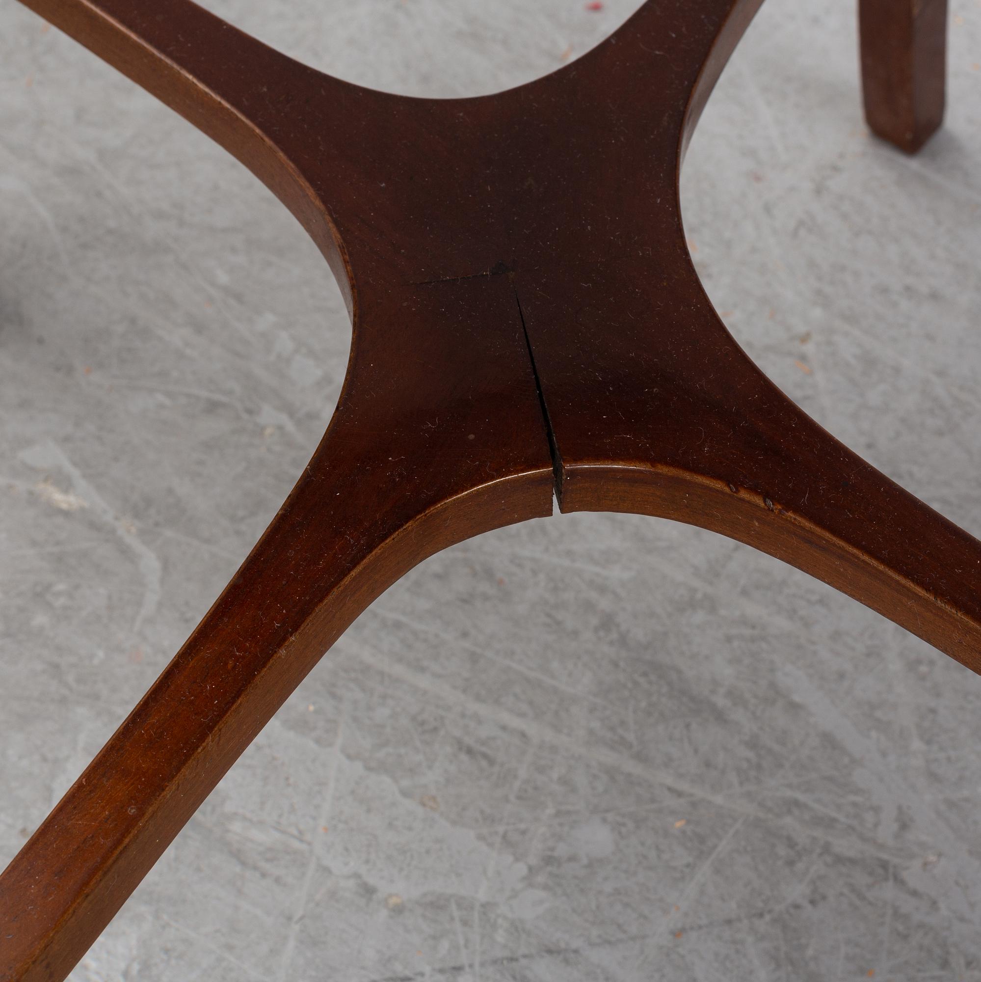 A mahogany veneered table with a Chinese blue and white porcelain charger, Qianlong (1736-95).