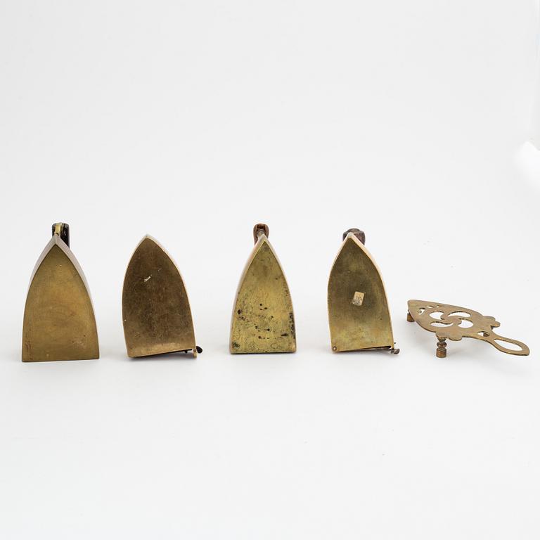 A set of four Swedish brass irons, 18th/19th Century.