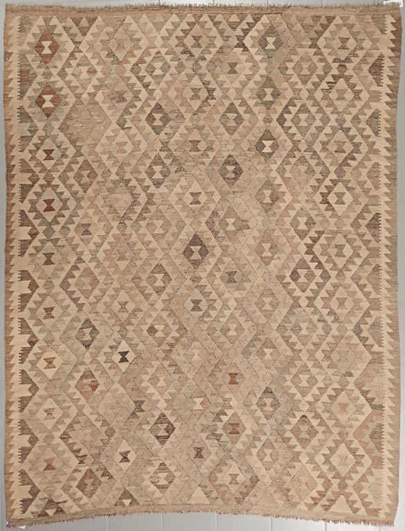 A kelim rug. C. 275 x 215 cm.