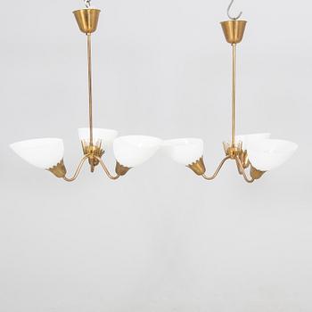 A pair of  ASEA Belysning brass 1950s ceiling pendants.