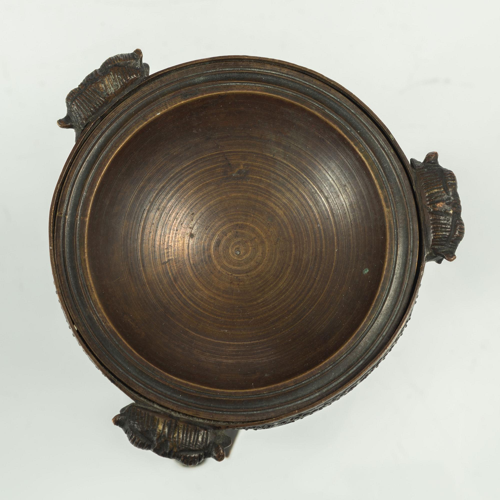 A French Empire ormolu and patinated brûle-parfume, early 19th century.