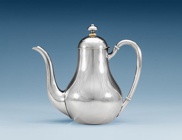 A RUSSIAN PARCEL-GILT TEA-POT, makers mark of Nichols & Plinke, St. Petersburg 1869.