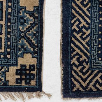 Two antique Chinese Pao-Tow rugs, c. 125 x 65 and 125 x 60 cm.
