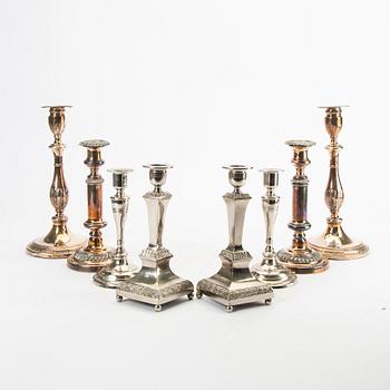 A set of four candle sticks epns and metal first half of the 20th century.