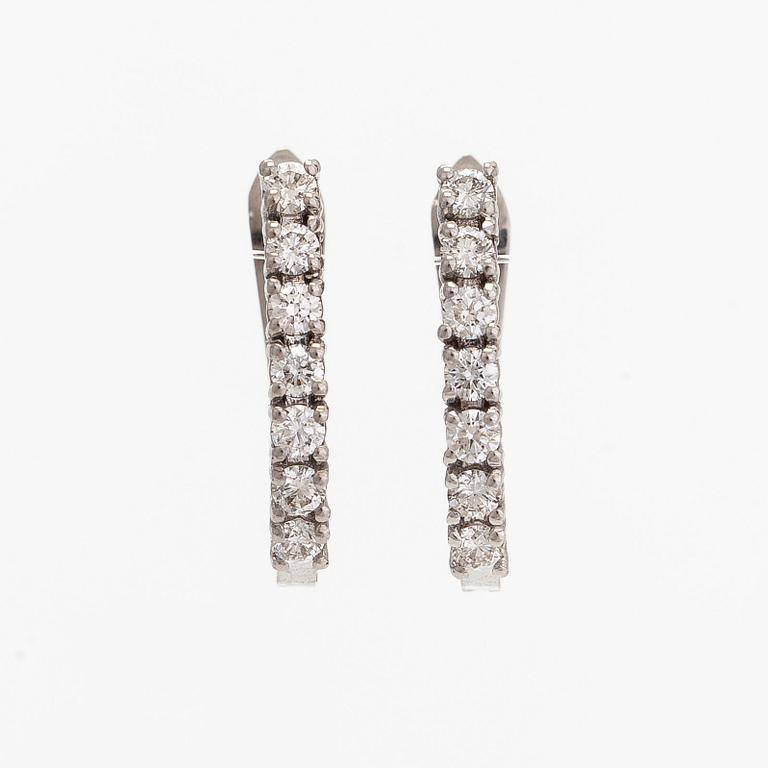 A pair of  14K gold earrings, with  brilliant-cut diamonds totalling approximately 0.56 ct.