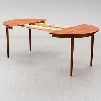 A 1950s/1960s teak table.