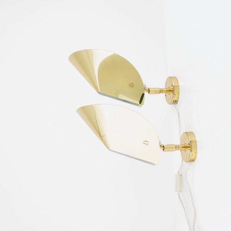 A pair of model 10302 brass wall lights, Aneta, Växjö.