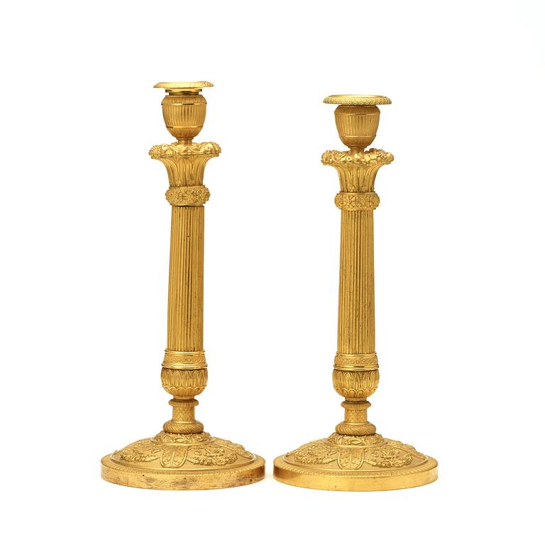 A pair of Empire early 19th century candlesticks.