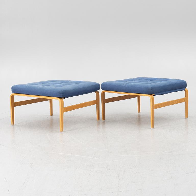 Bruno Mathsson, a pair of armchairs with ottomans, 'Ingrid', Dux, second half of the 20th century.