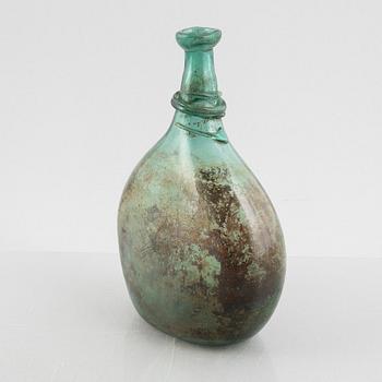 A turquoise tinted glass bottle, 19th century.