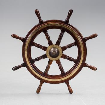 A ship steering wheel by John Hastle& Co Greenock, England, early 20th century.