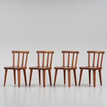 Axel Einar Hjorth, a set of four stained pine "Utö" chairs, Nordiska Kompaniet, Sweden, 1930s.