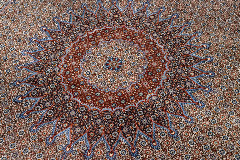 A Moud carpet, part silk, signed, c. 345 x 249 cm.