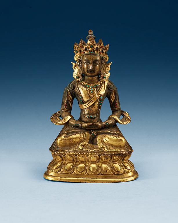 A partial-gilt bronze figure of Avalokiteshvara, Sino-Tibetan, 18th Century.