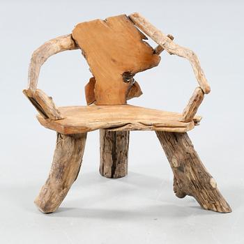 A wooden armchair, modern made.