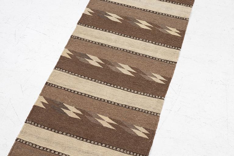 A Persian kilim runner, c. 248 x 62 cm.