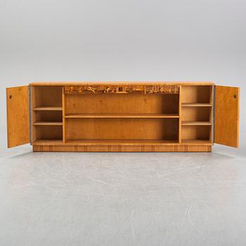 An inlaid bookcase from Mjölby Intarsia, 1930's.