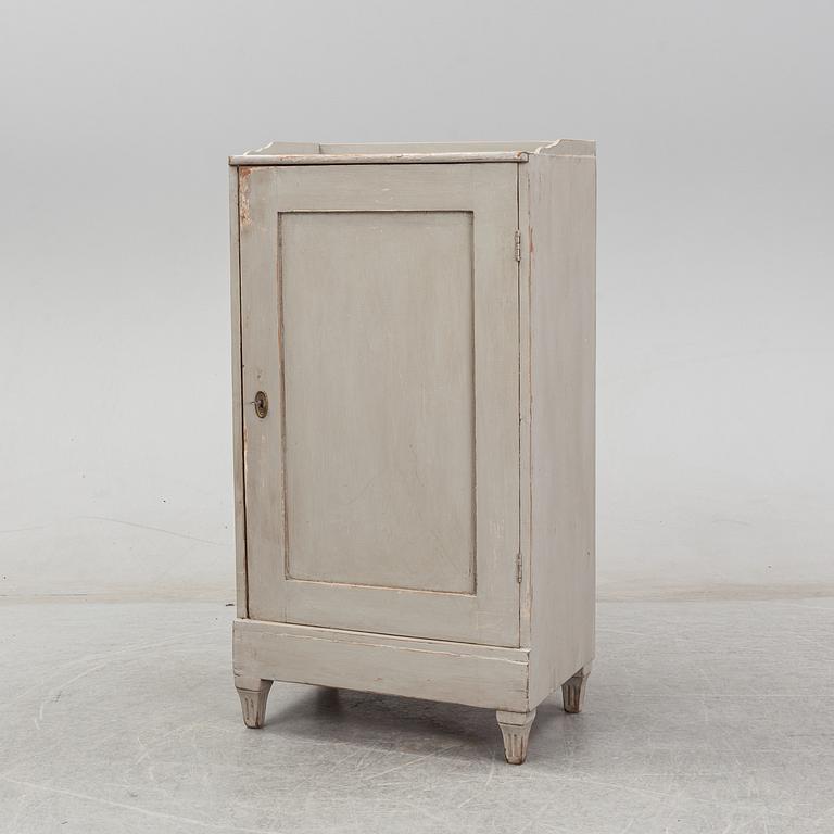 A 20th century gustavian style cupboard.