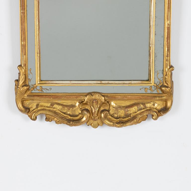 A Rococo giltwood mirror by N. Meunier (master in Stockholm 1754-97).