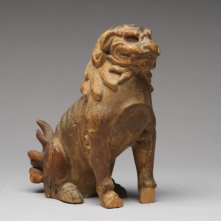 A wooden sculpture of a buddhist lion, Qing dynasty, 19th Century.