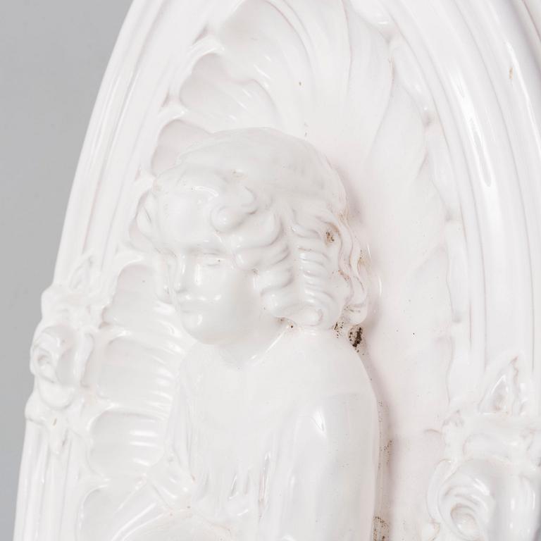 A ceramic wall relief, circa 1900.
