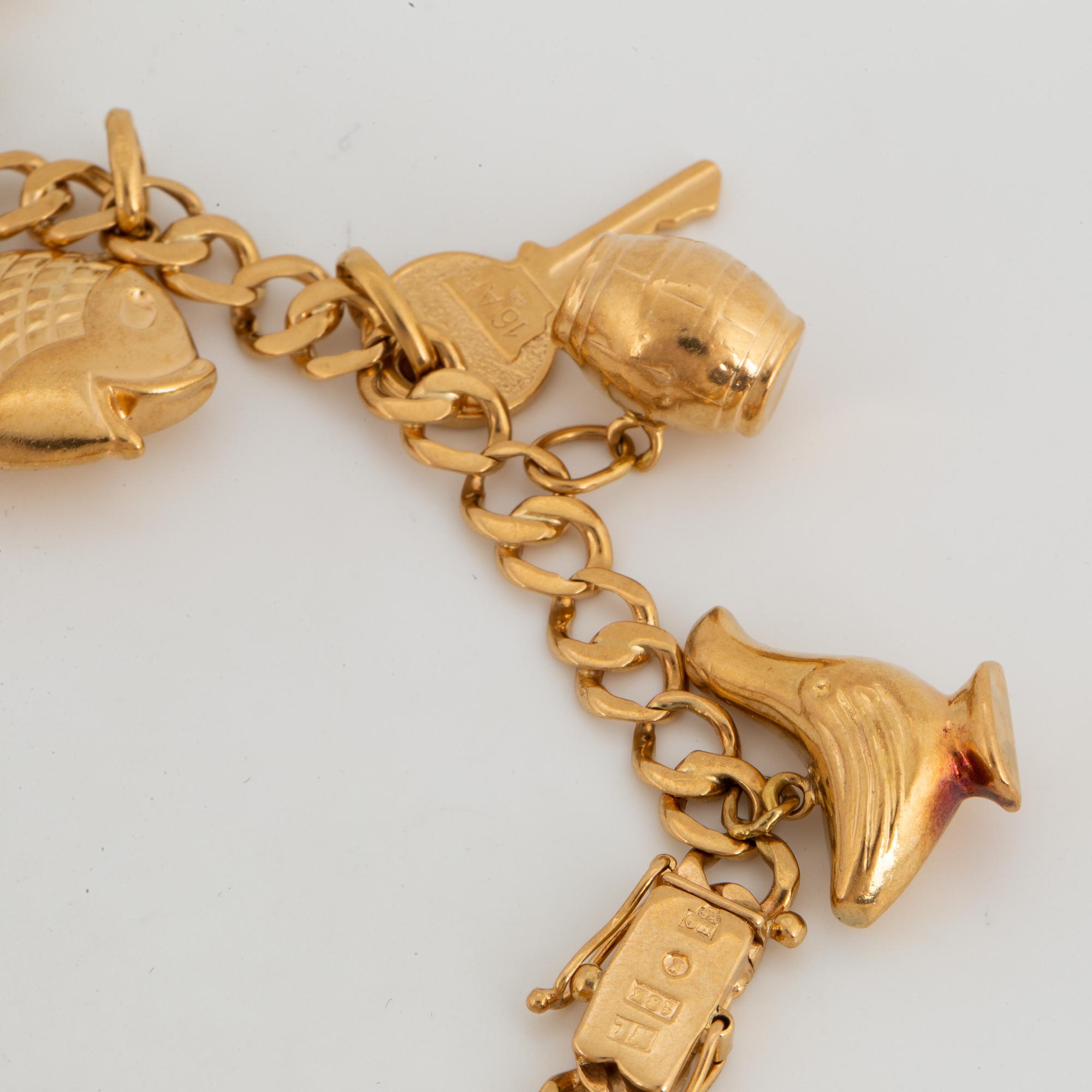 18K gold charm bracelet.
