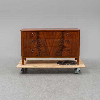 A 1940s Swedish Modern mahogany veneered chest of three drawers.