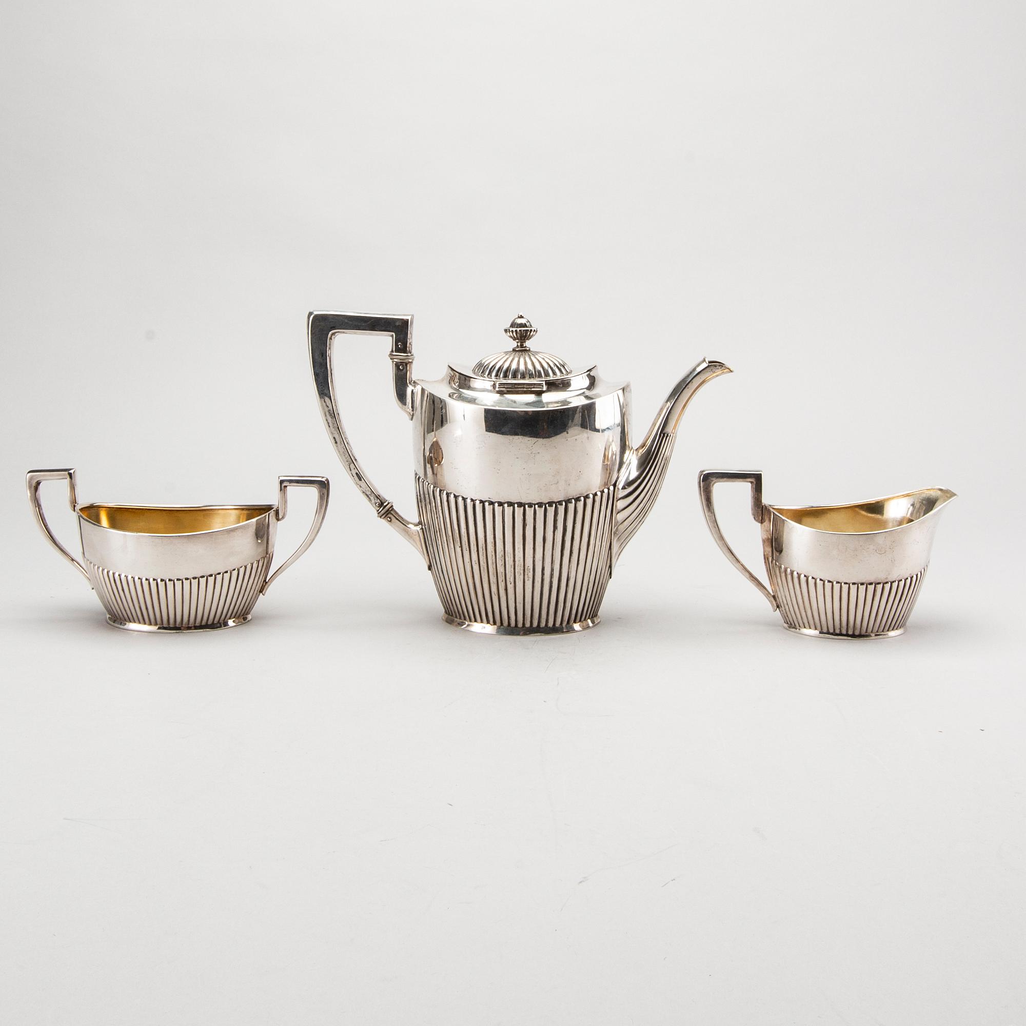 A three piece silver coffee service mark of CG Hallberg Stockholm 1916, weight 896 gram.