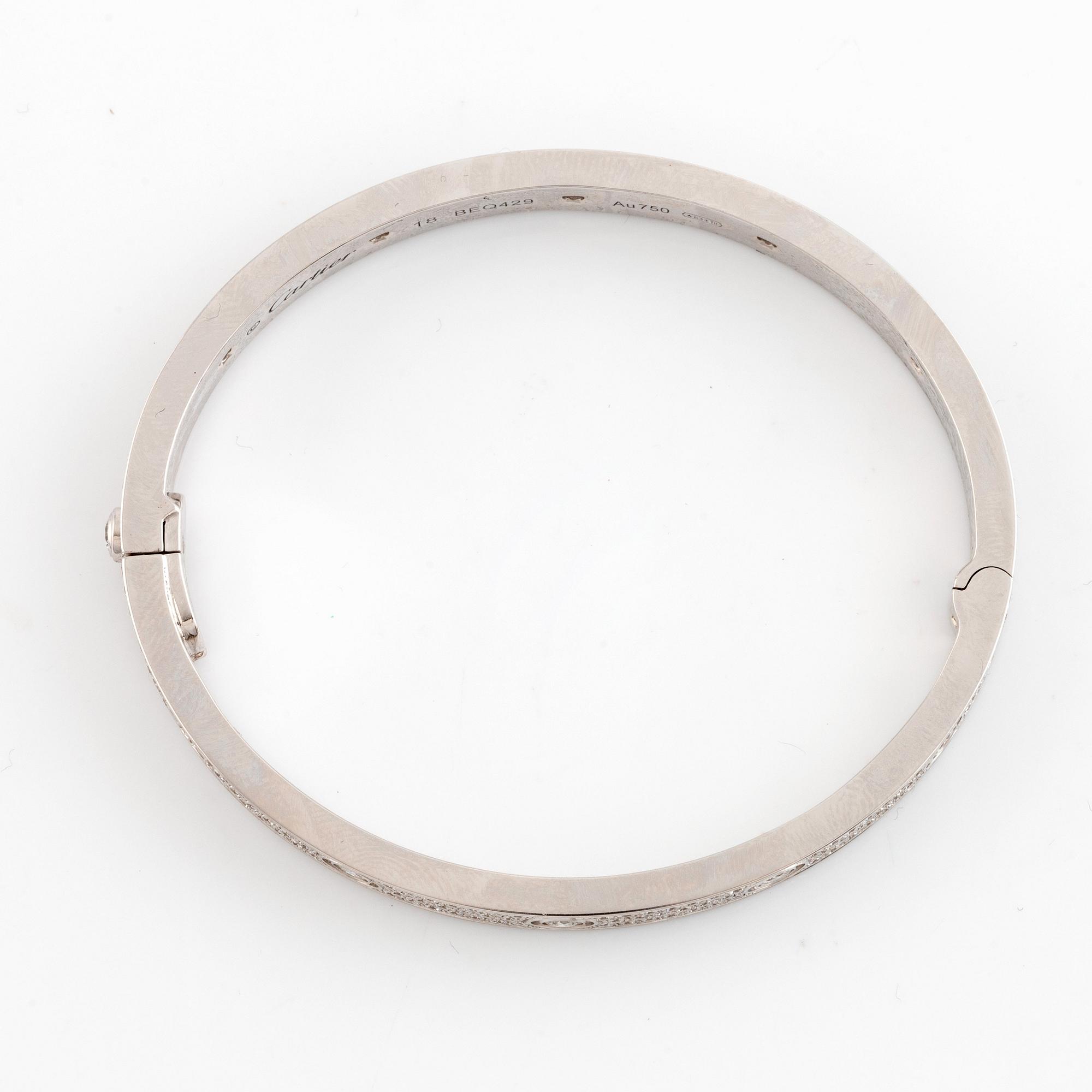 A Cartier "Love" bracelet in 18K white gold set with round brilliant-cut diamonds.
