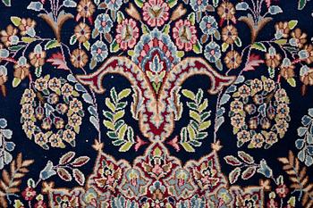 An oriental carpet, c. 385 x 300 cm.