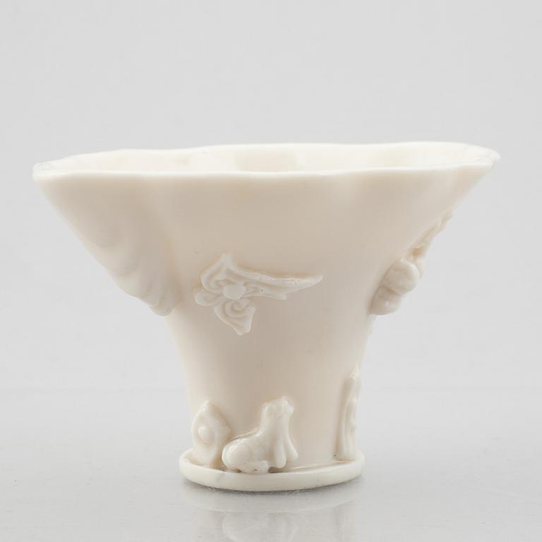 A blanc de chine rhinoceros libation cup, Qing dynasty, Kangxi (1662-1722).