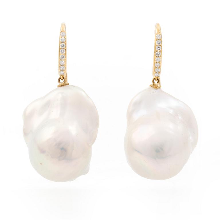 A pair of earrings with cultured baroque-shaped freshwater pearls and round brilliant-cut diamonds.