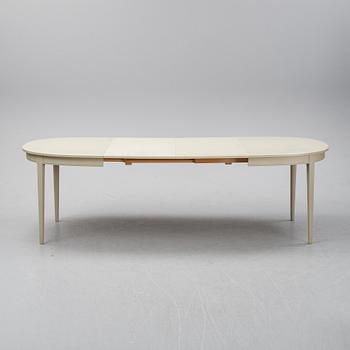 A dining table with two armchairs and six chairs by Carl Malmsten for Bodafors.