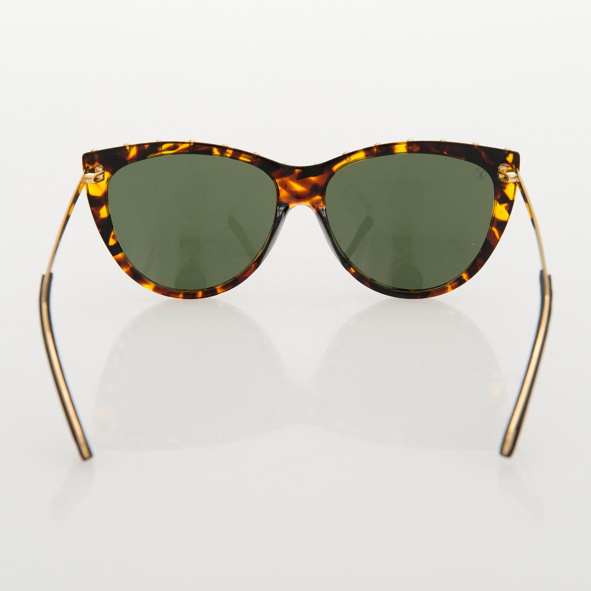 Louis Vuitton, 'La Boum' sunglasses and a Chouchou scrunchie.