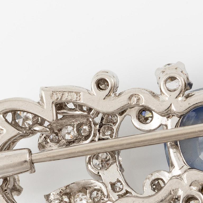 A W.A. Bolin brooch in platinum with a faceted sapphire.