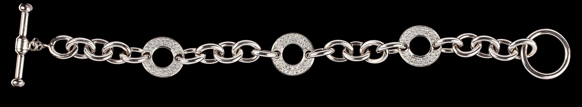 ARMBAND, länkar med 3 ringar med infattade briljantslipade diamanter, tot. ca 2.20 cts.