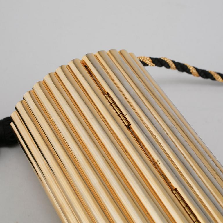 AFTONVÄSKA, "Gold Tassel Clutch", Yves Saint Laurent.