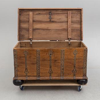 A 18th century baroque oak chest with iron mountings.