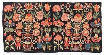 310. A carrige cushion, "Urnor och par", tapestry weave, ca 98 x 50 cm, around the years 1800-1825.